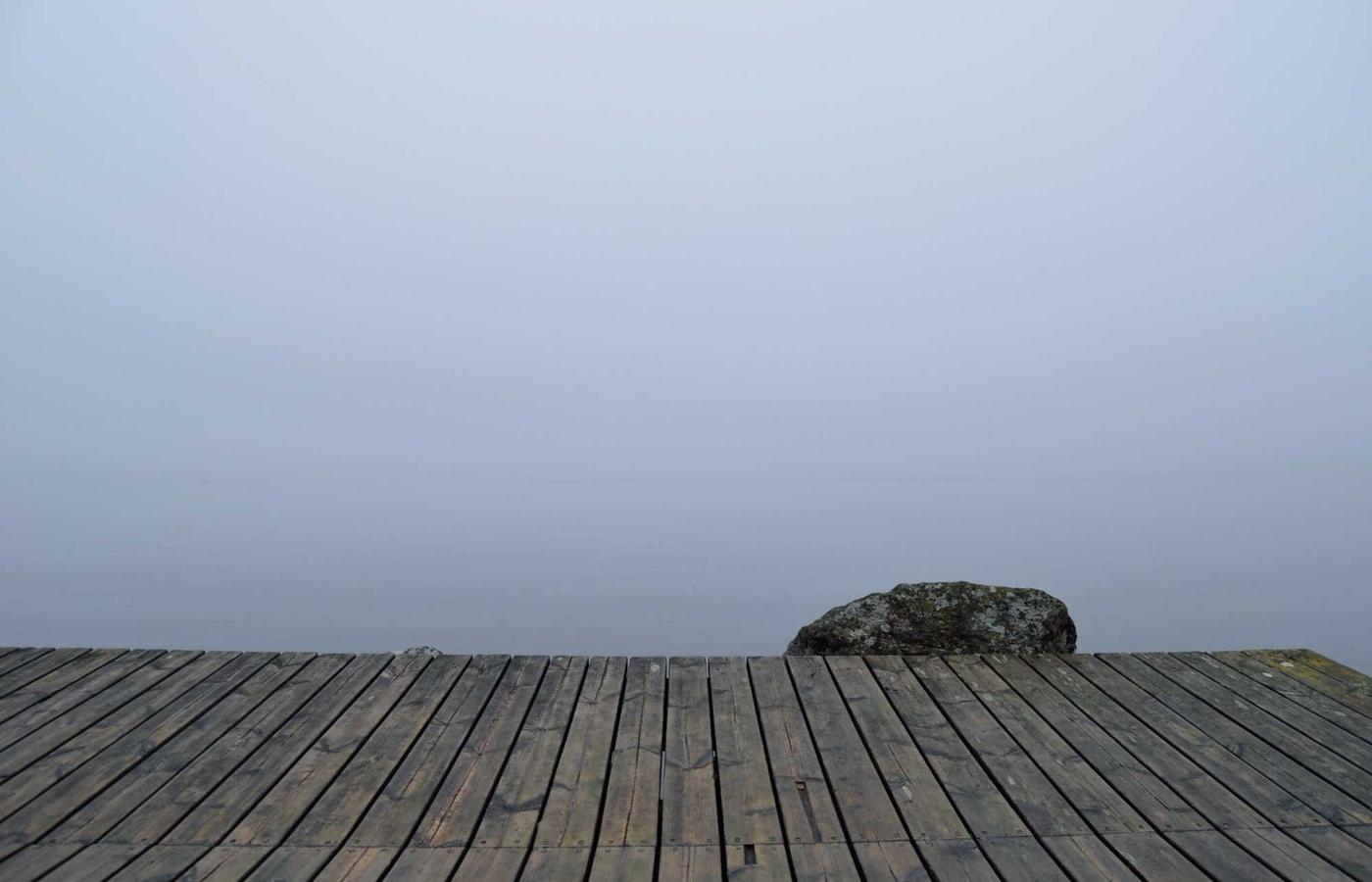 An electric vehicle charging against a backdrop of BC's mountains.